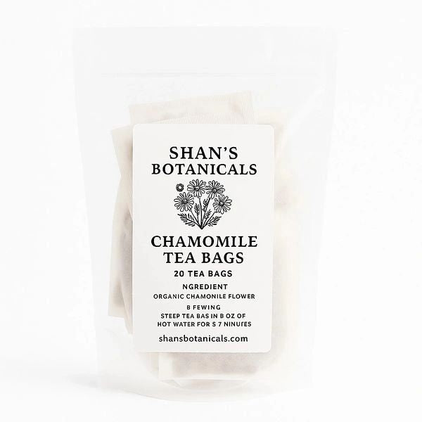 Organic Chamomile Tea Bags in white resealable pouch with calming caffeine free herbal tea made from premium chamomile flowers for relaxation and wellness.