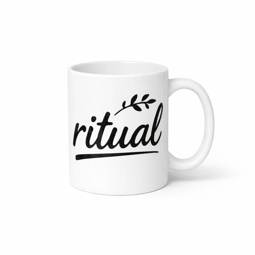 White mug with 'ritual' text on a white background